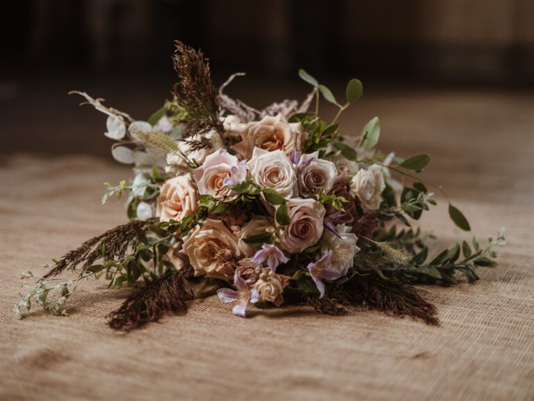 An autumn bouqet created by our inhouse florist rests on the floor of the Great Hall of Bilsington Priory near Ashford, a wedding venue that offers Ceremony Only Wedding Packages